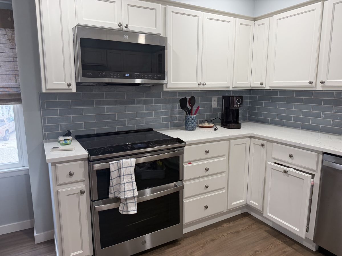 Kitchen cleaned and staged with clear counters after turnover