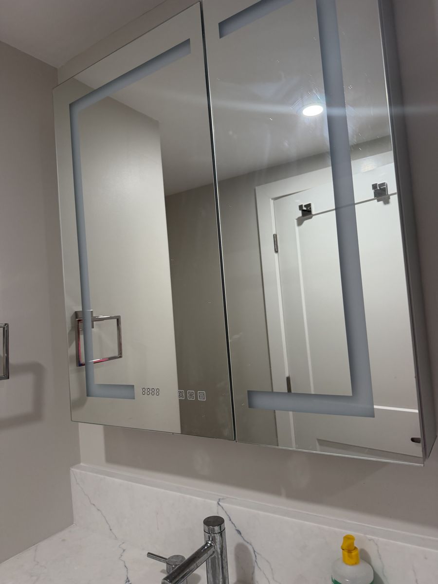 Bathroom vanity and lit mirror polished after turnover