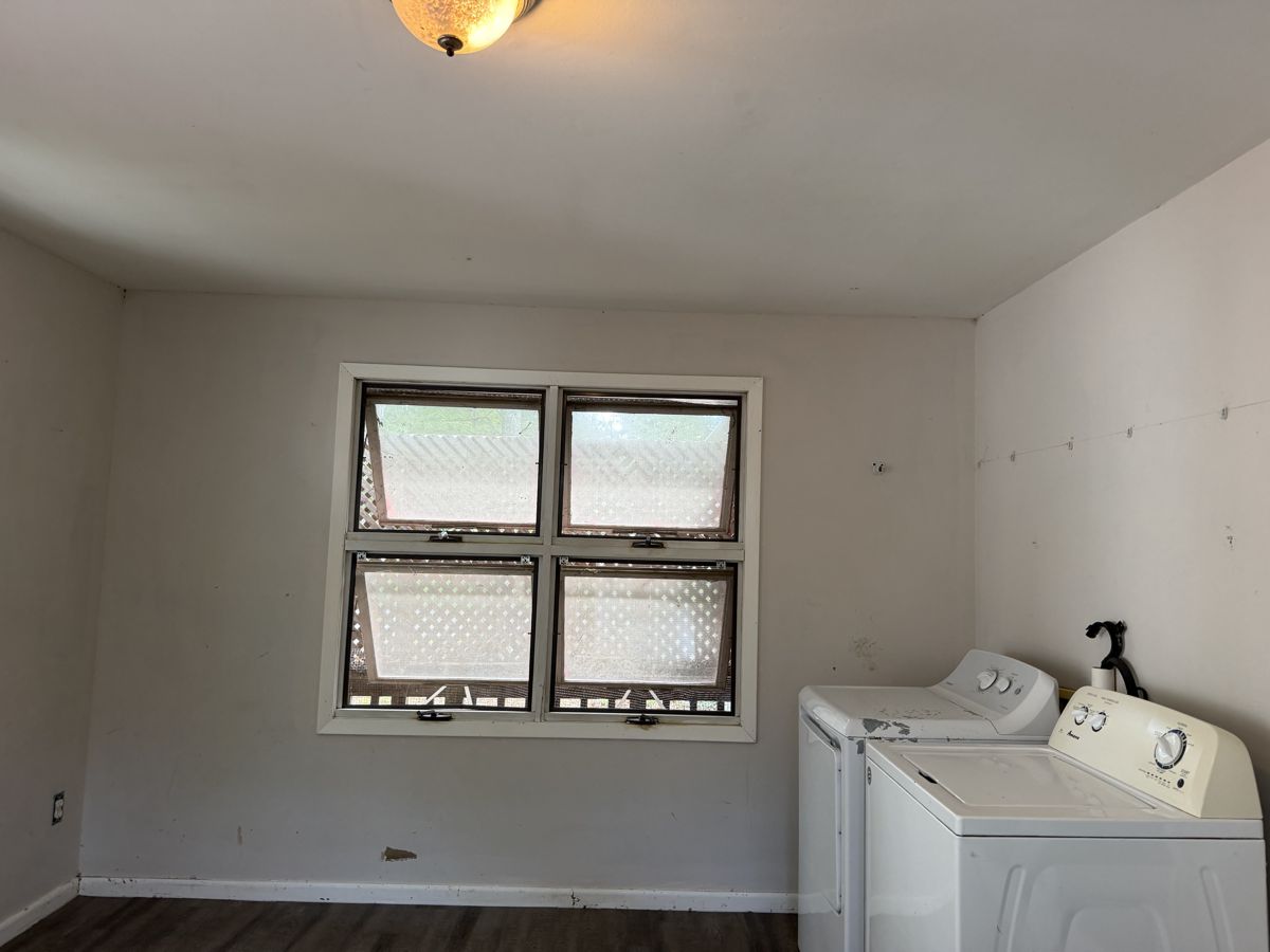 Same washer wall clean and bright with machines in place after deep cleaning