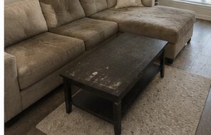 Living room with stained table before cleaning