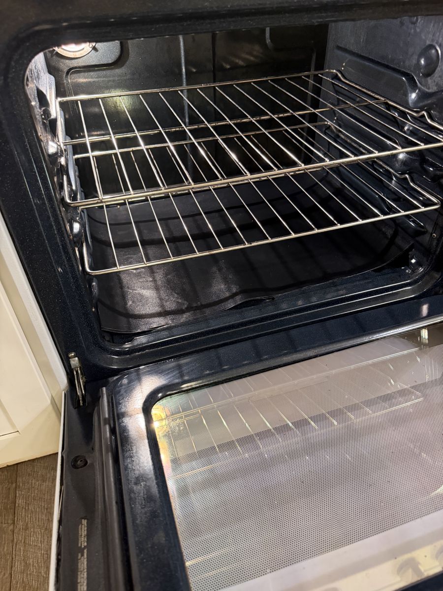 Oven interior with shining racks and glass after deep cleaning