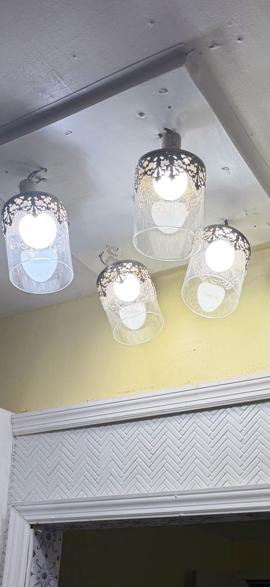 Pendant lights under a grimy smoke-stained ceiling before cleaning