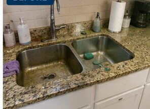 Stained kitchen sink before cleaning