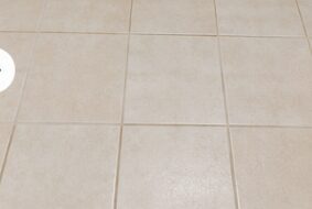 Tile floor with clean bright grout after cleaning